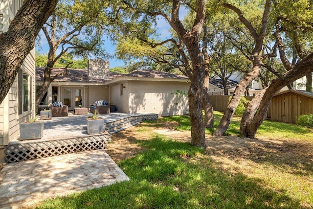 rear view of property featuring a patio