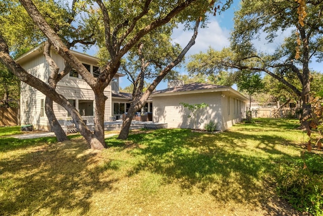 back of property featuring a lawn