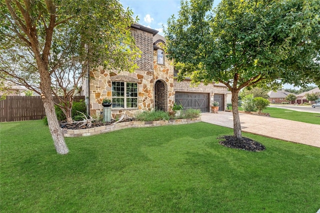 view of front of home with a garage and a front yard