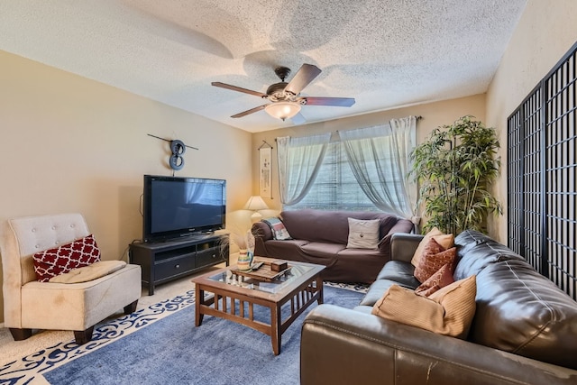 carpeted living room with ceiling fan and a textured ceiling