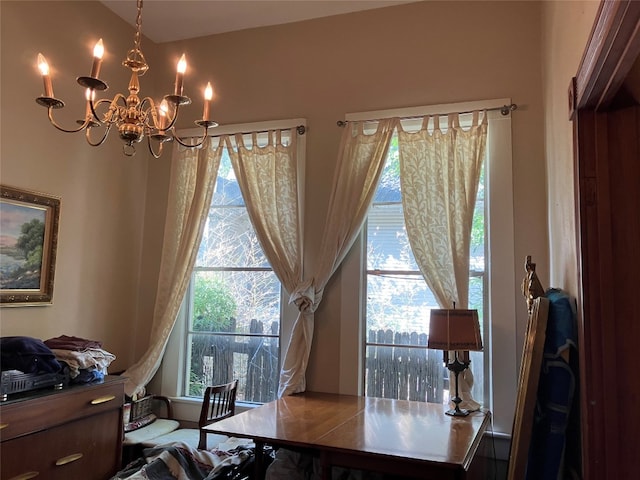 home office featuring an inviting chandelier