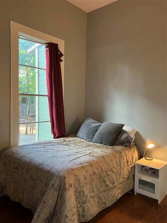 bedroom featuring dark hardwood / wood-style flooring