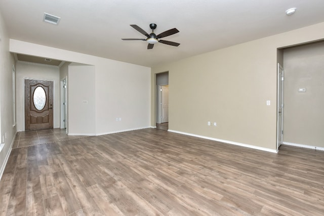 unfurnished living room with hardwood / wood-style flooring and ceiling fan