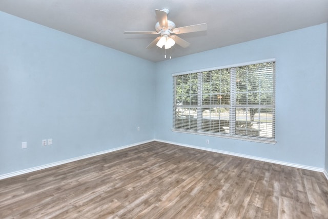 unfurnished room with wood-type flooring and ceiling fan