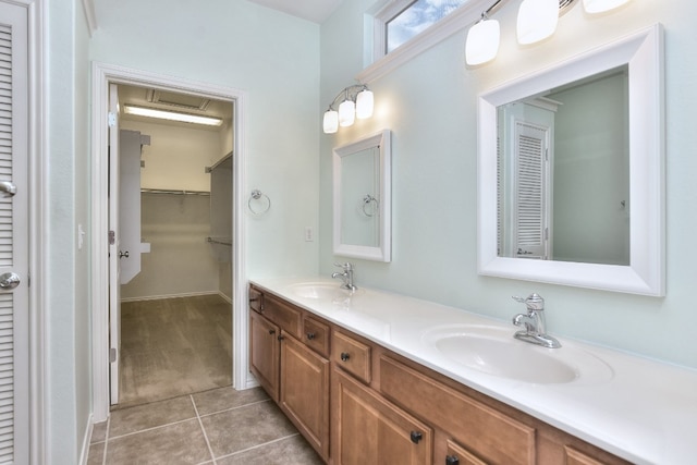 bathroom with tile patterned flooring and vanity