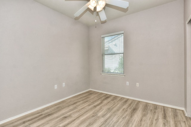 empty room with light wood-type flooring and ceiling fan