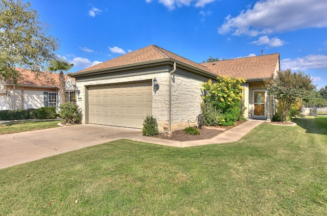 ranch-style house featuring a garage and a front yard