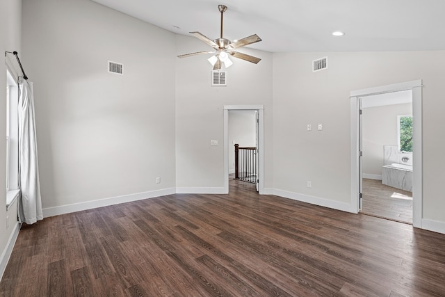 interior space with dark hardwood / wood-style flooring, high vaulted ceiling, and ceiling fan