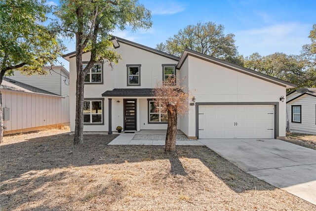 view of front of home featuring a garage and a porch