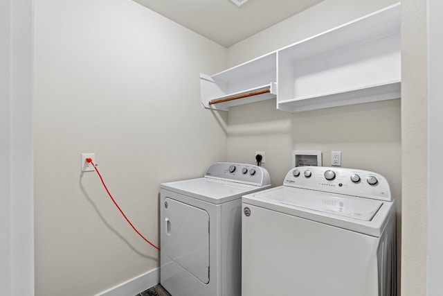 washroom featuring washer and clothes dryer