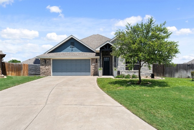 view of front facade featuring a garage and a front lawn