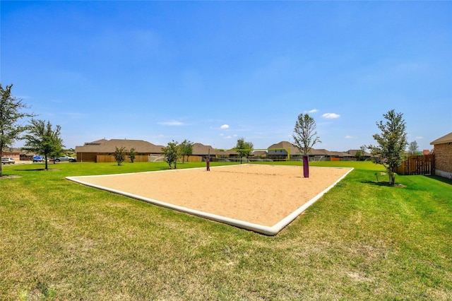 surrounding community with volleyball court, a yard, fence, and a residential view