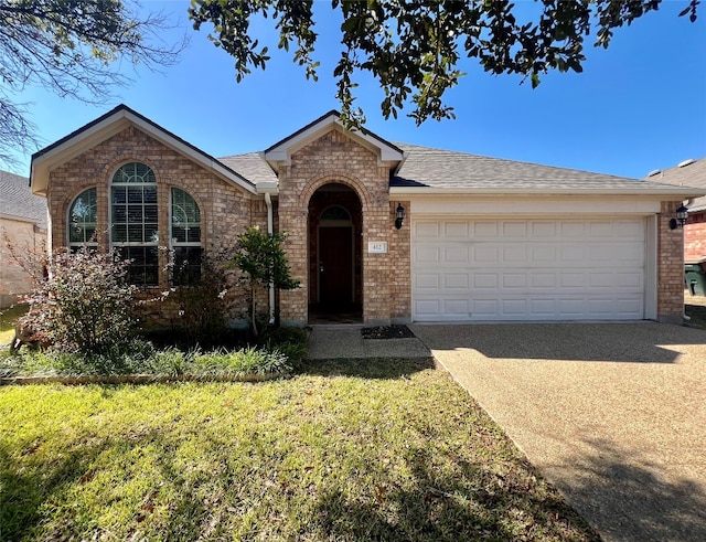 single story home with a front lawn and a garage