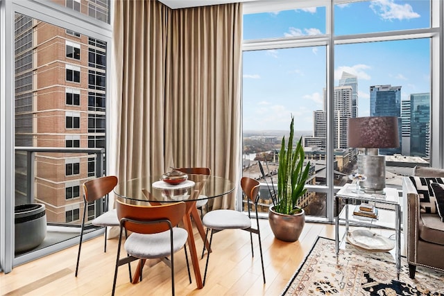 interior space with hardwood / wood-style flooring and floor to ceiling windows