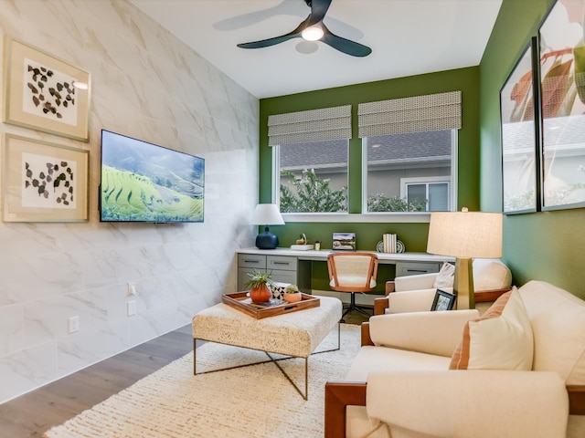 interior space with ceiling fan and a wealth of natural light