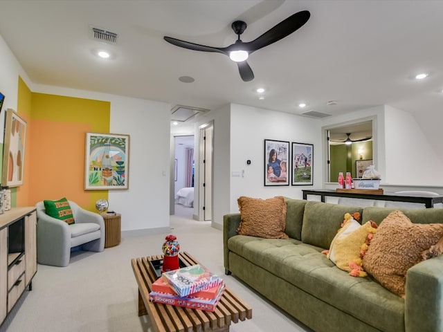 living room featuring ceiling fan and light colored carpet