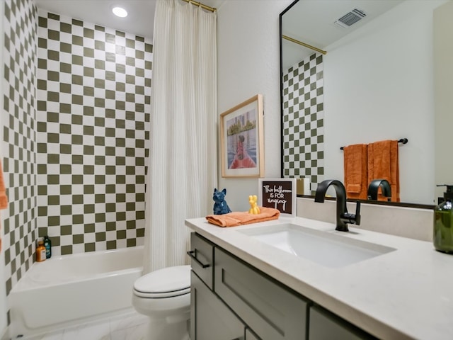 full bathroom with shower / tub combo, vanity, and toilet