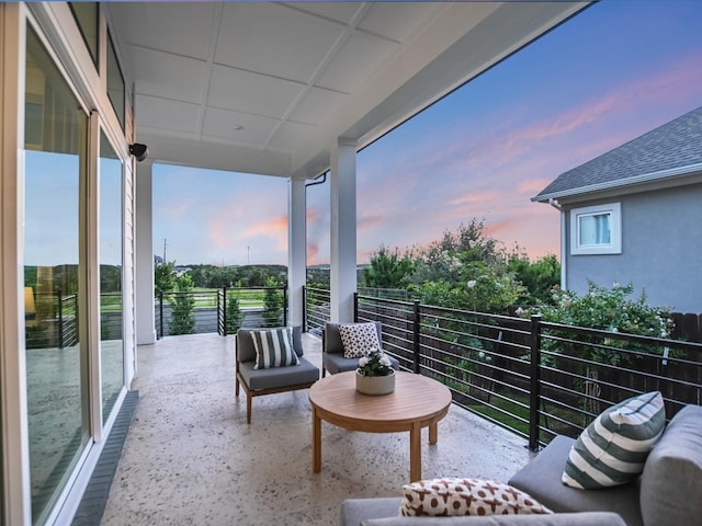 view of balcony at dusk