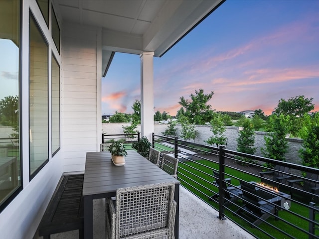 view of balcony at dusk