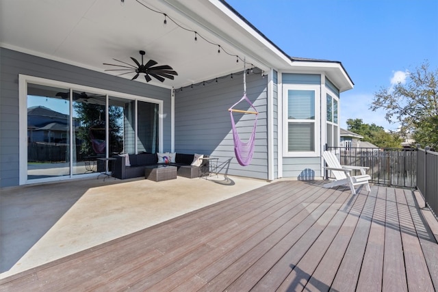 deck featuring ceiling fan and an outdoor hangout area