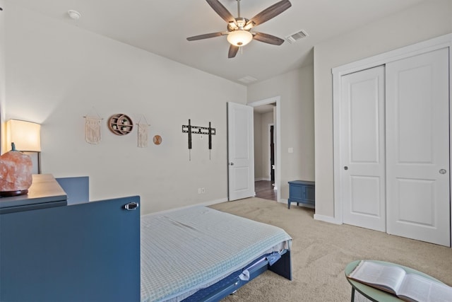 bedroom featuring a closet, carpet flooring, and ceiling fan