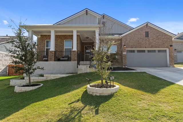 craftsman-style home with a front lawn, covered porch, and a garage