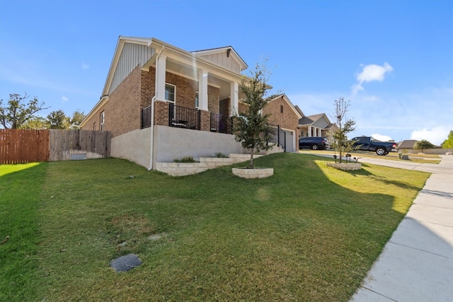 exterior space featuring a front lawn and a porch