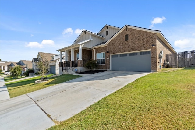 view of front of home with a garage and a front lawn