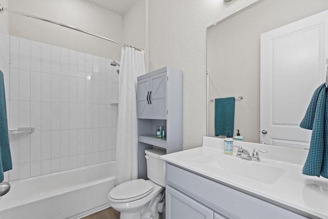 full bathroom featuring toilet, shower / tub combo with curtain, and vanity