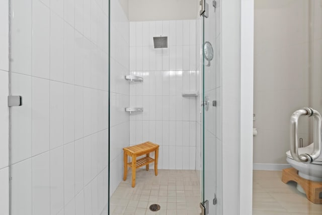 bathroom with tile patterned floors and an enclosed shower