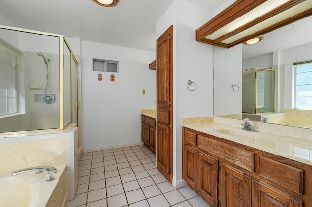 bathroom featuring tile patterned floors, vanity, and independent shower and bath