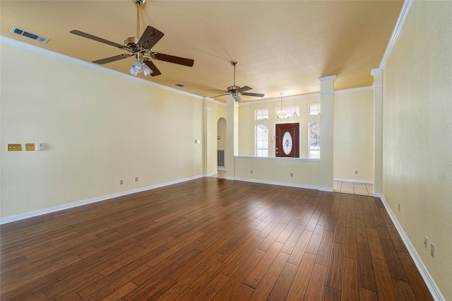 unfurnished living room with ceiling fan, crown molding, and dark hardwood / wood-style floors