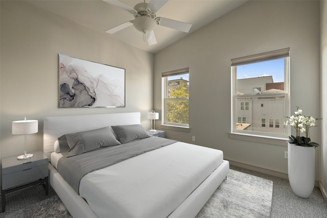 bedroom with carpet, lofted ceiling, and ceiling fan