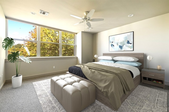 bedroom featuring ceiling fan and carpet