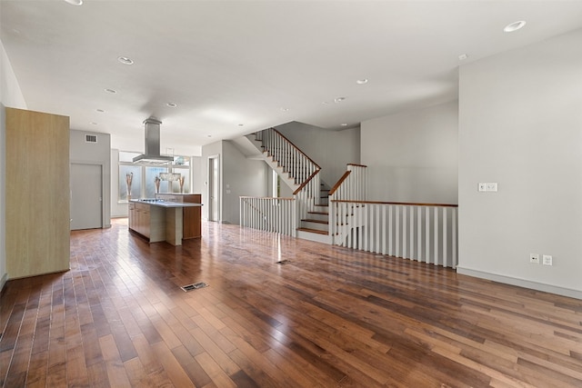 unfurnished living room with dark hardwood / wood-style flooring