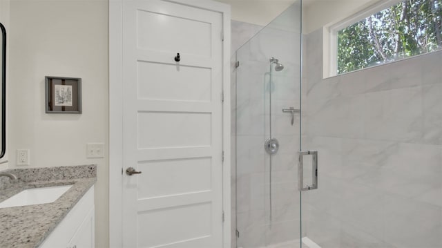 full bathroom featuring vanity and a stall shower