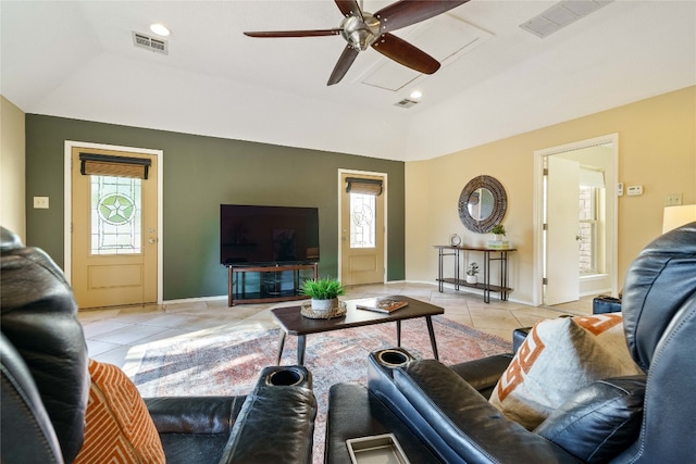 tiled living room with ceiling fan and a wealth of natural light