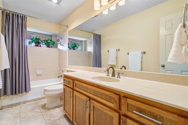 full bathroom with tile patterned floors, vanity, shower / tub combo, and toilet