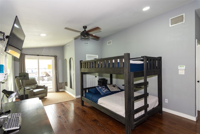 bedroom featuring dark wood-type flooring, lofted ceiling, and ceiling fan