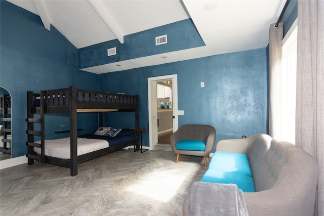 bedroom with beamed ceiling, parquet flooring, and high vaulted ceiling