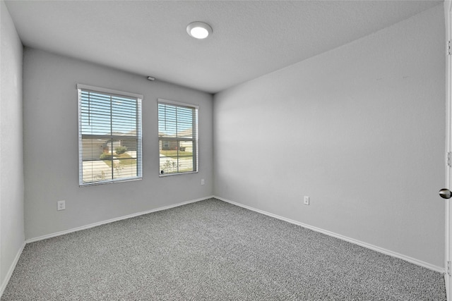 unfurnished room featuring carpet flooring