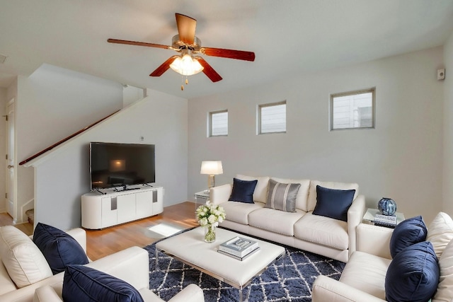 living room with hardwood / wood-style flooring and ceiling fan