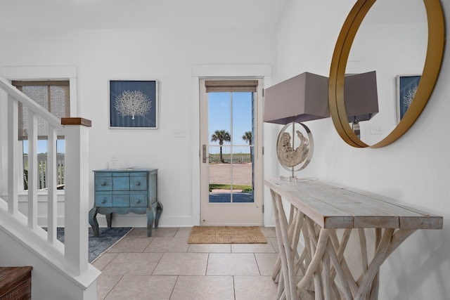 foyer with a healthy amount of sunlight and light tile patterned floors