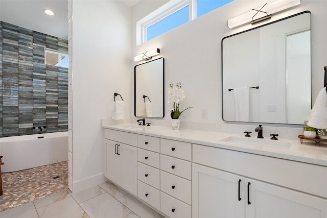 bathroom featuring tile patterned floors, vanity, and a bath