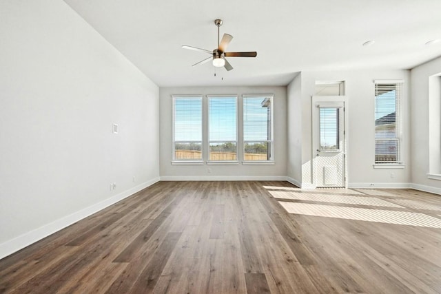 unfurnished room featuring ceiling fan and hardwood / wood-style floors