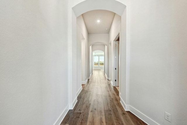 corridor with dark wood-type flooring