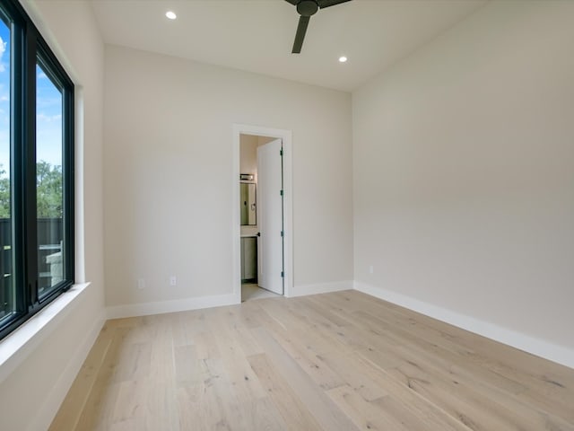 empty room featuring light hardwood / wood-style flooring and ceiling fan