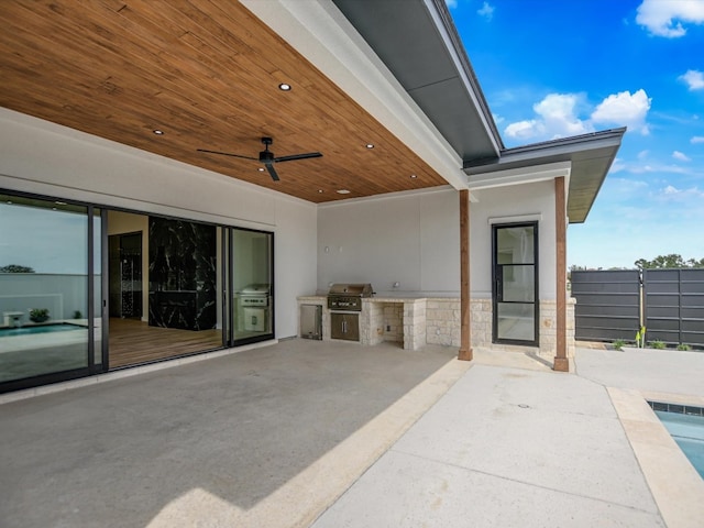 view of patio / terrace featuring area for grilling and ceiling fan