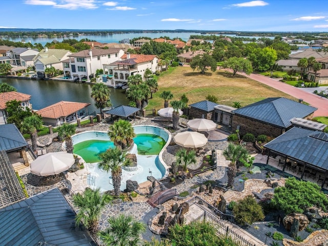 birds eye view of property featuring a water view