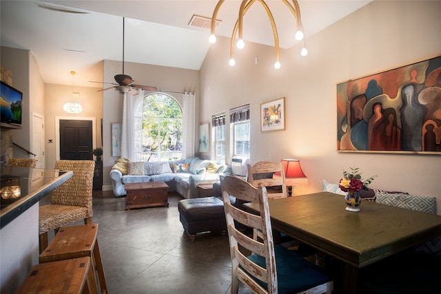 dining room with high vaulted ceiling and ceiling fan